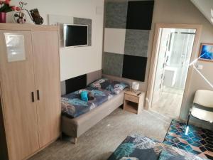 A bed or beds in a room at APARTMÁNY PIETRO