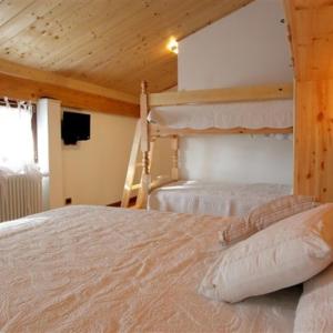 A bed or beds in a room at B&B La Soldanella