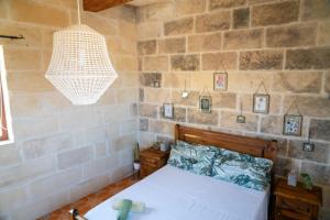 Katil atau katil-katil dalam bilik di Laremi Gozo B&B