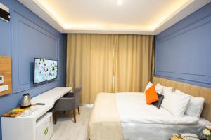 En eller flere senge i et værelse på Taksim Leon's Hotel