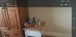 a kitchen with a wooden counter with food on it at Cherry blossom. In Erris 