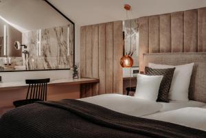 Postel nebo postele na pokoji v ubytování Der Eisvogel - Wellness- & Genusshotel