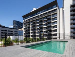 a swimming pool in front of a building at Phenomenal Stay In Phillip in Phillip