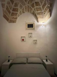 a bedroom with a bed in a room with a ceiling at Casa Vacanze Momò a Nardò in Nardò +15 photos