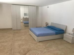 מיטה או מיטות בחדר ב-FH HOLIDAYS SALENTO