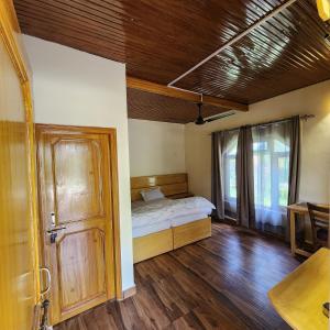 Namlang Resort客房内的一张或多张床位