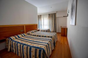 Postel nebo postele na pokoji v ubytování Hotel Los Barruecos by Croma