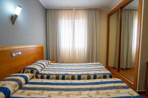 Postel nebo postele na pokoji v ubytování Hotel Los Barruecos by Croma