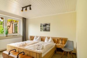 Postel nebo postele na pokoji v ubytování Strandhus Uiterst-hörn Steuerbord