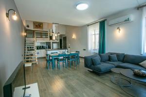 a living room with a couch and a table at Luxe Apartment in Center in Yerevan