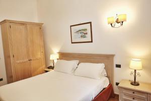 Cama o camas de una habitación en Albergo Filippo II