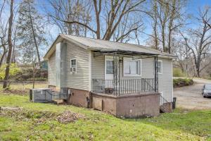a small house with a porch on a yard at Small 2br East Knox apartment Pet friendly in Knoxville