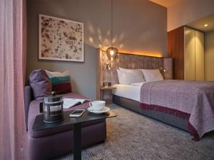 Postel nebo postele na pokoji v ubytování Adina Apartment Hotel Nuremberg