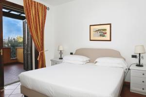 Postel nebo postele na pokoji v ubytování Albergo Filippo II + 37 fotografií