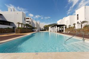 a swimming pool in the middle of a building at Casa del Mar in Mojácar