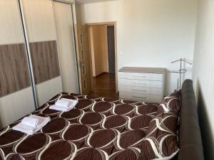 a bedroom with a bed with two towels on it at 2 Rooms Apartment in Michalovce in Michalovce