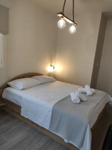 Łóżko lub łóżka w pokoju w obiekcie Casa la Scala