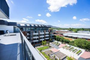 an apartment balcony with a view of a building at Lux 2 Bed 2 Bath Apartment in the Heart of Dickson, Canberra in Canberra
