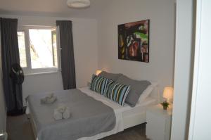 Łóżko lub łóżka w pokoju w obiekcie Summer House Krištof