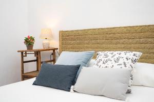 Łóżko lub łóżka w pokoju w obiekcie La Casa 1832 Boutique