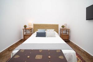 Łóżko lub łóżka w pokoju w obiekcie La Casa 1832 Boutique