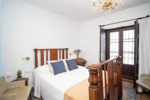 Łóżko lub łóżka w pokoju w obiekcie La Casa 1832 Boutique