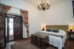 Łóżko lub łóżka w pokoju w obiekcie La Casa 1832 Boutique