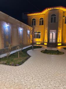 a yellow building with a door with lights on it at Elite Boutique in Samarkand +11 photos