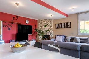 a living room with a couch and a table at Villa Yulia in Vidreres