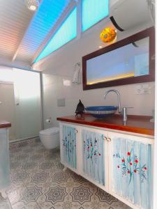 a bathroom with a sink and a toilet at Denizkizi butik otel in Küçükkuyu