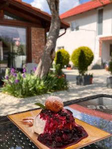 a plate of food sitting on a table at Casa Cenţiu in Bran
