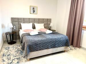 ELFF -Apartamenty i pokoje gościnne客房内的一张或多张床位