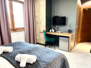 ELFF -Apartamenty i pokoje gościnne客房内的一张或多张床位