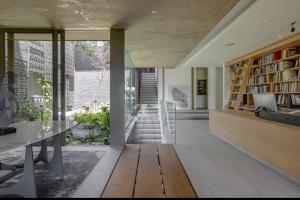 a home office with a desk and bookshelves at Blair Atholl Estate in Lanseria