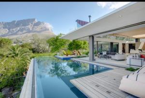 a house with a view of the mountains at Blair Atholl Estate in Lanseria