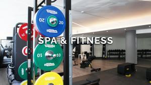 a gym with a sign that reads spa and fitness at The Hive Hotel in Rome