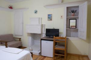 TV a/nebo společenská místnost v ubytování Kavala Rooms