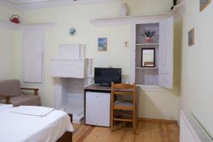 TV a/nebo společenská místnost v ubytování Kavala Rooms