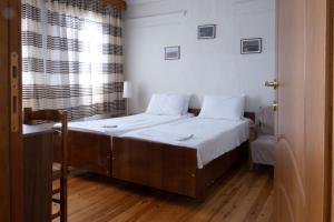 Postel nebo postele na pokoji v ubytování Kavala Rooms