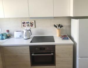 a kitchen with a sink and a stove top oven at Farm stay in Maceira, Leiria 