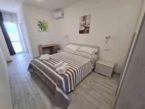 Ένα ή περισσότερα κρεβάτια σε δωμάτιο στο Civico 14 Apartment 4B