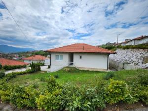 a small white house with a red roof at Villa Sarajevo 5 in Sarajevo