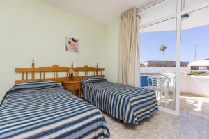 Postel nebo postele na pokoji v ubytování Hotel LIVVO Veril Playa