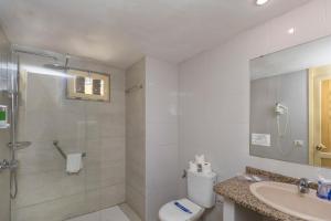 a bathroom with a shower and a toilet and a sink at Hotel LIVVO Veril Playa in Playa del Ingles