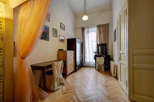 a living room with a table and a window at Apartment Bolshaya Morskaya in Saint Petersburg