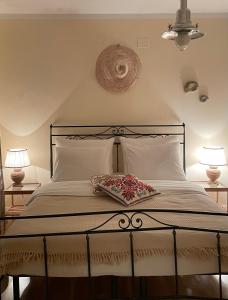 a bedroom with a large bed with two lamps at Villa Schober Baška in Baška