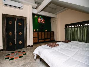 Katil atau katil-katil dalam bilik di Thai Authentic House