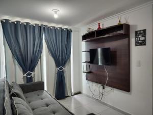 TV a/nebo společenská místnost v ubytování One Cabo Branco