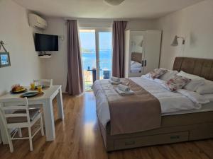 Postel nebo postele na pokoji v ubytování Apartmani Luan