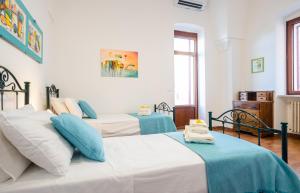 A bed or beds in a room at Villa Luritu Luxury Pool Tricase by HDSalento